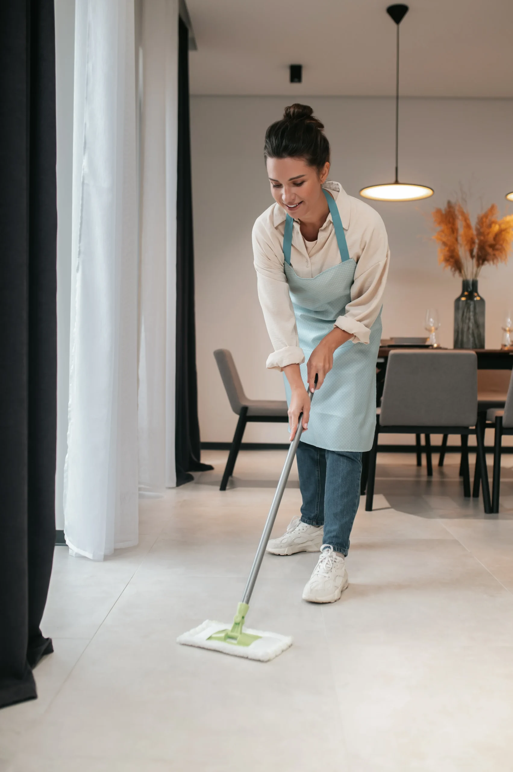 cleaning-kitchen-young-woman-apron-cleaning floor